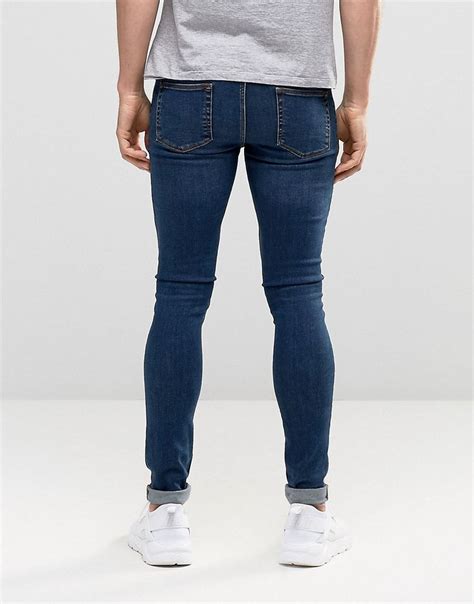 ASOS Extreme Super Skinny Jeans With Knee Rips In Dark Wash At Asos