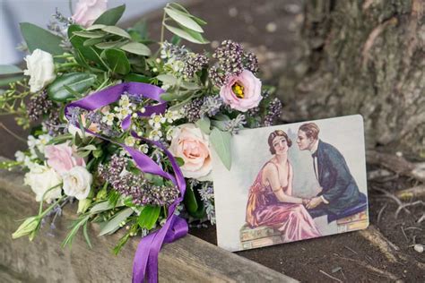 pink and dark purple wedding bouquet at base of tree, pink and white roses, dark purple queen ...