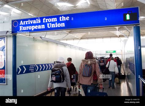 Passengers Passing Through The Arrivals From The European Union Stock