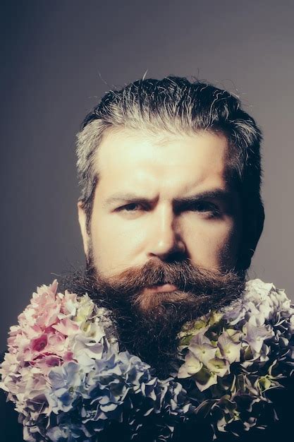 Premium Photo Bearded Man With Hydrangea Flowers