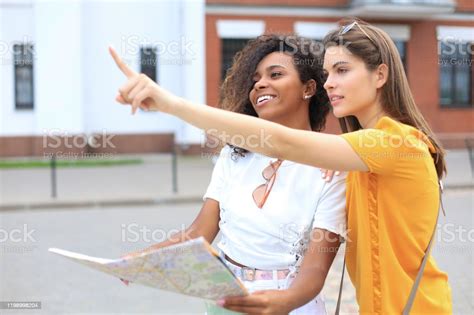 Photo Of Two Girls Enjoying Sightseeing Outdoor Beautiful Female