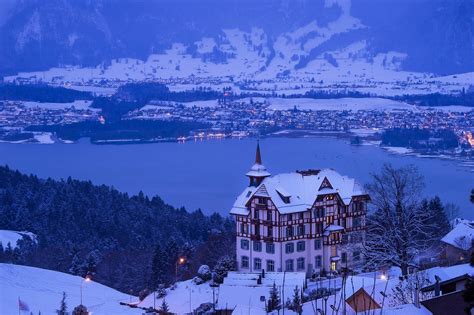 Download Winter In Swiss Alps Cabins Wallpaper | Wallpapers.com