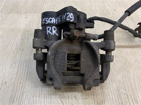 DG9C2D252AA Ford суппорт тормозной задний правый