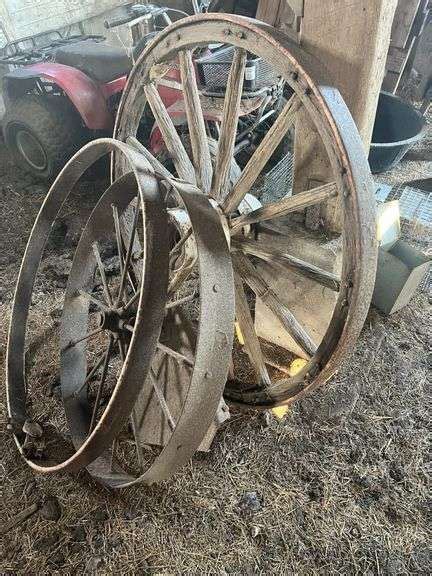 2 Wooden Wagon Wheels Metzger Property Services LLC