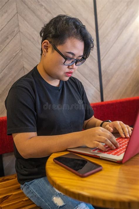 Portrait Of Asian Lesbian Using Laptop And Smartphone At Cafeteria Stock Photo Image Of Black