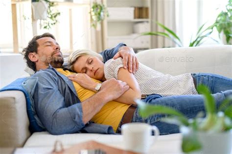 Happy couple in love on sofa indoors at home, sleeping | Couple poses ...