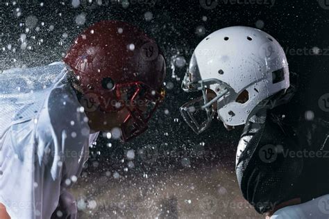 Two American Football Players Face To Face In Silhouette Shadow On