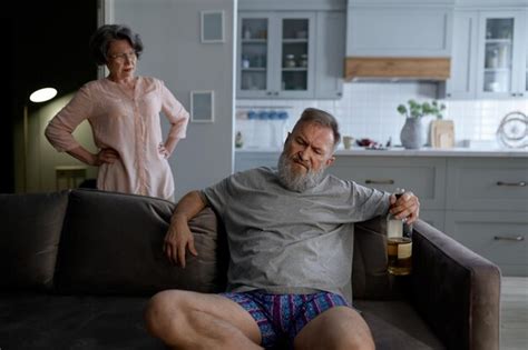 Premium Photo Worried Mature Wife Calming Her Drunk Aged Husband Feeling Depressed Problem In