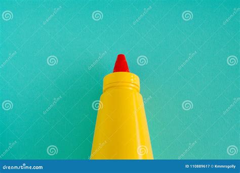 A Bright Yellow Mustard Bottle With Red Lid Stock Image Image Of