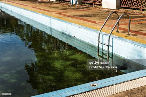 Old Abandoned Swimming Pool With Dirty Water High Res Stock Photo