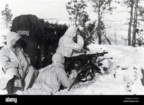 German Soldiers In Snow Camouflage Suits With An Mg On The Russian