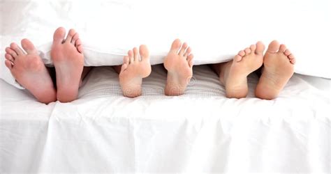 Feet of Barefoot Family on Bed Under Covers Stock Footage - Video of house, bedtime: 297394532