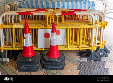 Stacked Traffic Cones And Construction Barriers Barricades Stock Photo