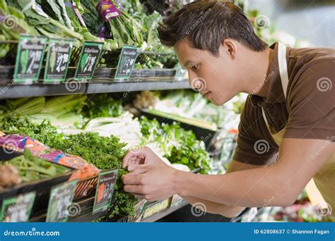 Sales Assistant Working In A Supermarket Stock Image Image Of Food