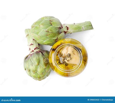 Open Jar Of Delicious Artichokes Pickled In Olive Oil And Fresh