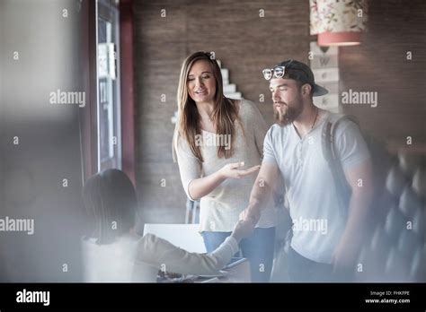 Young Woman Introducing A Friend Stock Photo Alamy