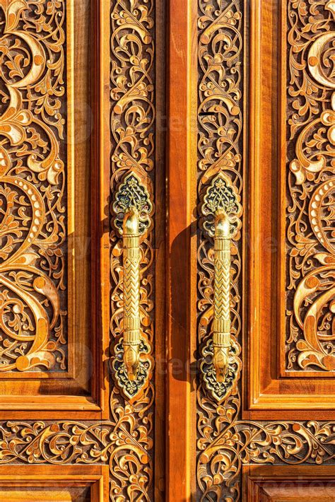 Carved Wooden Doors With Gilded Metal Handles Stock Photo At