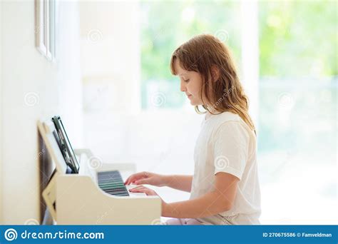 Child Playing Piano. Kids Play Music Stock Photo - Image of family ...