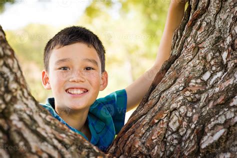 Outdoor Portrait Of A Biracial Chinese And Caucasian Boy