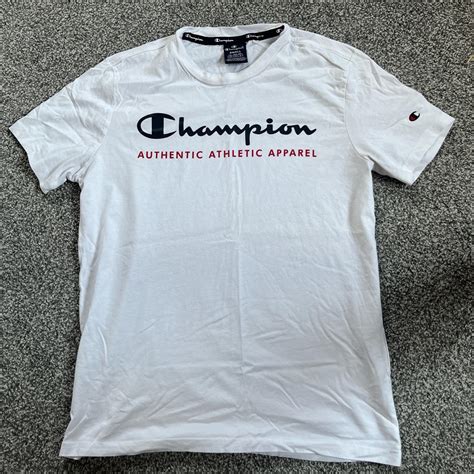 White Champion T-shirt, black logo and red... - Depop