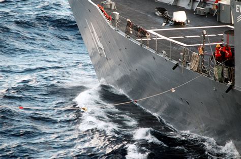 A Sailor Handles A Line On The Guided Missile Frigate Uss John H Sides