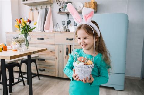 Premium Photo Cute Girl In Bunny Ears Holding Basket With Easter Eggs