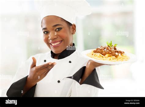 Beautiful Afro American Chef Presenting Spaghetti Stock Photo Alamy