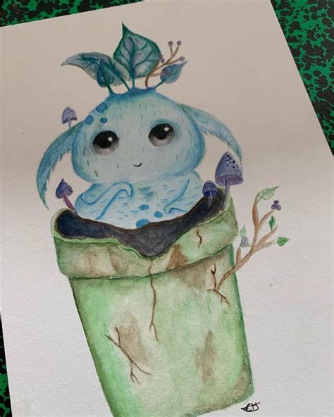 A Drawing Of A Blue Creature In A Green Trash Can With Leaves On Its Head