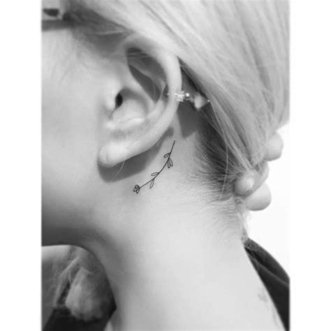 Fine Line Flower Tattoo Located Behind The Ear