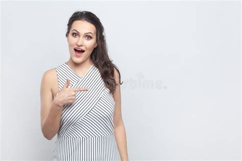 Amazed Surprised Woman Pointing Away With Index Fingers Showing Copy