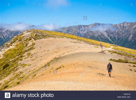 Hikers On Paddys Track On Mount Robert Above Lake Rotoiti In Nelson