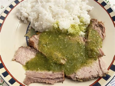 Cerdo En Salsa De Tomatillo Con Arroz Blanco Imagen De Archivo Imagen