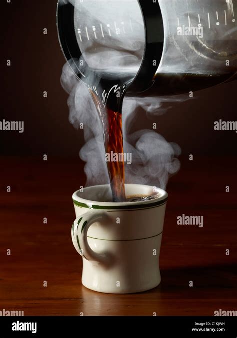 Pouring Coffee Into Mug Stock Photo Alamy