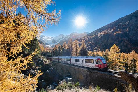 Tourist train on the swiss alps passes through mountains 4192206 Stock ...