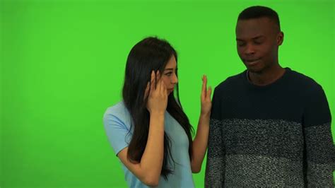 A Young Asian Woman And A Young Black Man Cry Green Screen Studio