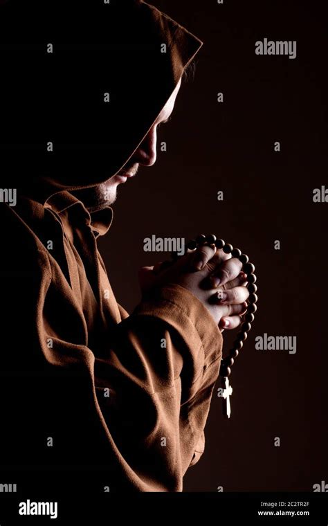 Monk In Robe With Two Hands Clasped In Prayer Stock Photo Alamy