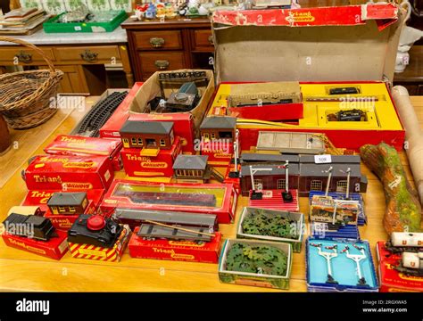 Boxes of vintage Tri-ang Railways scale model toy train set on display in auction room, UK Stock ...