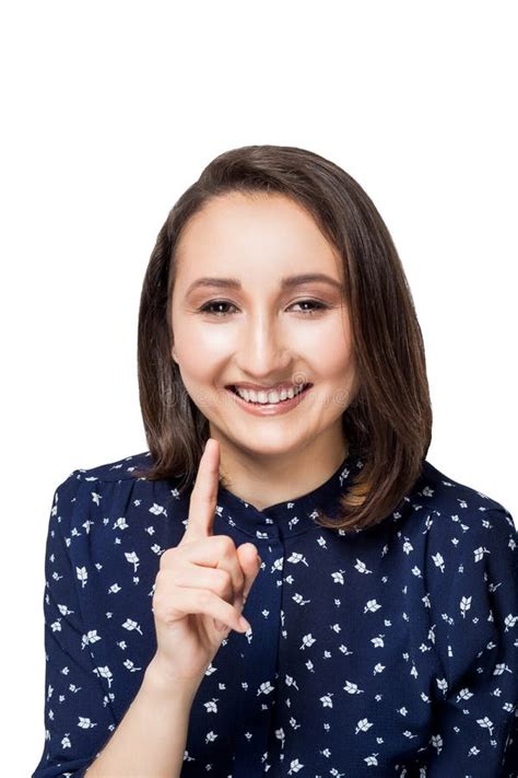 Beautiful Brunette Girl In Blue Blouse Has Fun Fooling Around Shows The Index Finger With A