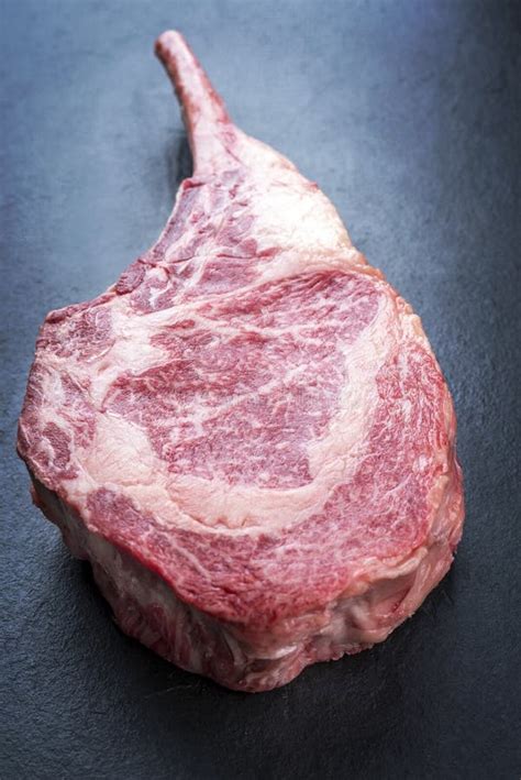 Raw Dry Aged Wagyu Tomahawk Steak On Black Board Stock Photo Image Of