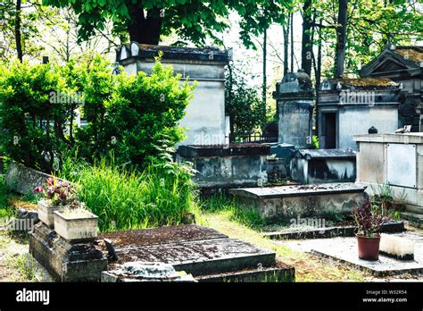 Tombstones In Cemetery At Dusk Gothic Style Crosses Paris Stock Photo