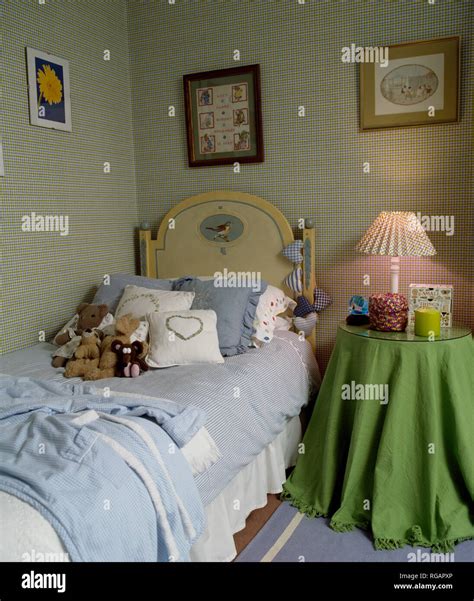 Checked wallpaper in bedroom with single bed Stock Photo - Alamy