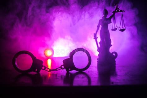 Legal Law Concept Silhouette Of Handcuffs With The Statue Of Justice