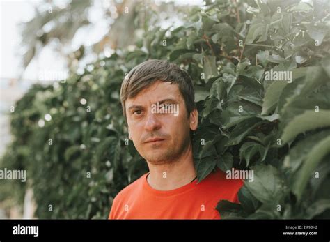 Portrait Of Face Harsh Angry Unshaven Mature 40 Years Man Solo Traveler With Stubble And Brown