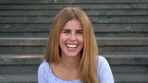 A Woman Smiling While Sitting On Some Steps 41395361 Stock Video At