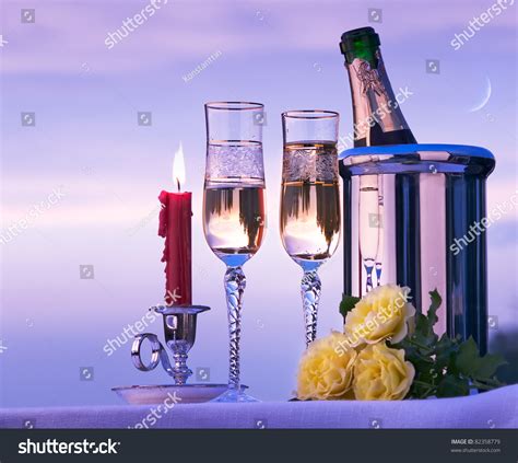 Happy Romantic Dinner With White Wine On The Sky Background Stock Photo