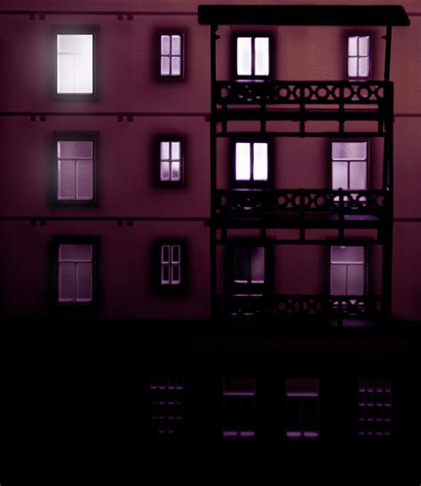 Apartment Building At Night With Lights by Michael Duva