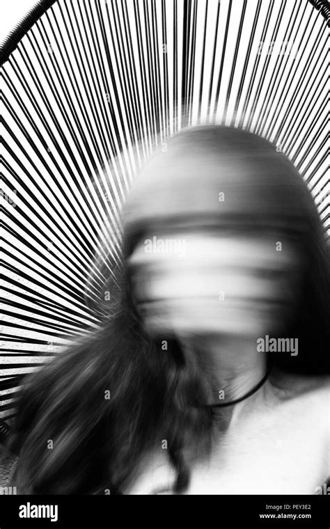 Creative Abstract Portrait Of Faceless Woman In Motion Blur In Black