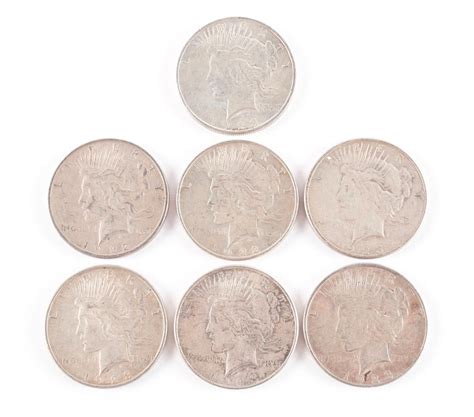 Lot - SEVEN U.S. SILVER PEACE DOLLARS