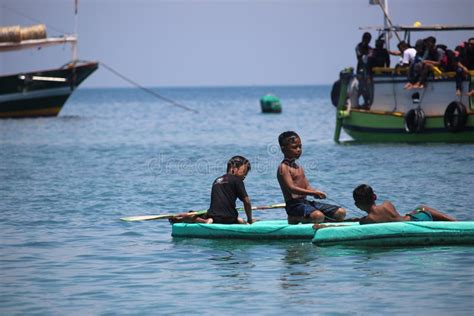 Small Children Play Boats Like Kayak on the Beach of Gili Ketapang ...