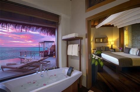 Baros Maldives. Water Pool Villa View at day and during Sunset